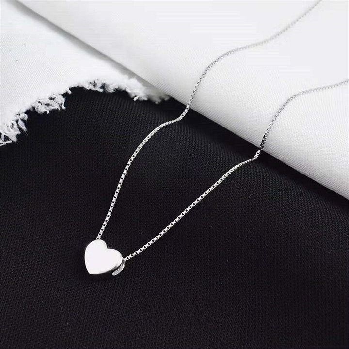 Minimalistische Herzkette aus glattem 925 Sterling Silber für Damen, zeitloser Damenschmuck.