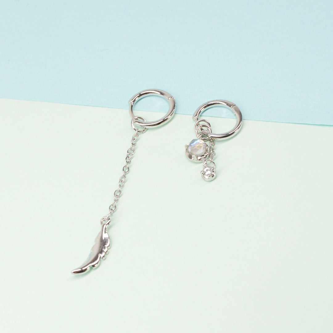 Elegante Federohrringe aus Sterlingsilber für Damen, besetzt mit schillerndem Mondstein. Perfekte Geschenkidee.