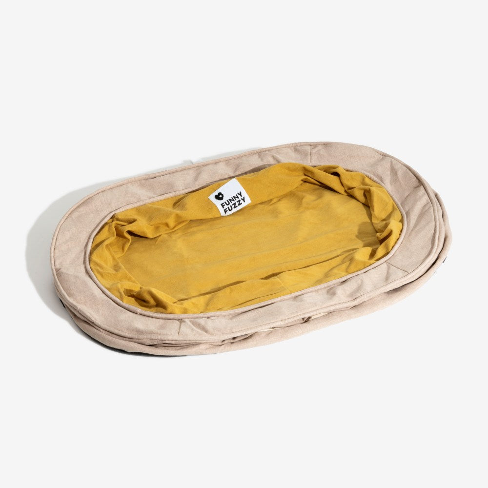 Hundebettbezug in Donutform aus waschbarem Polyester.