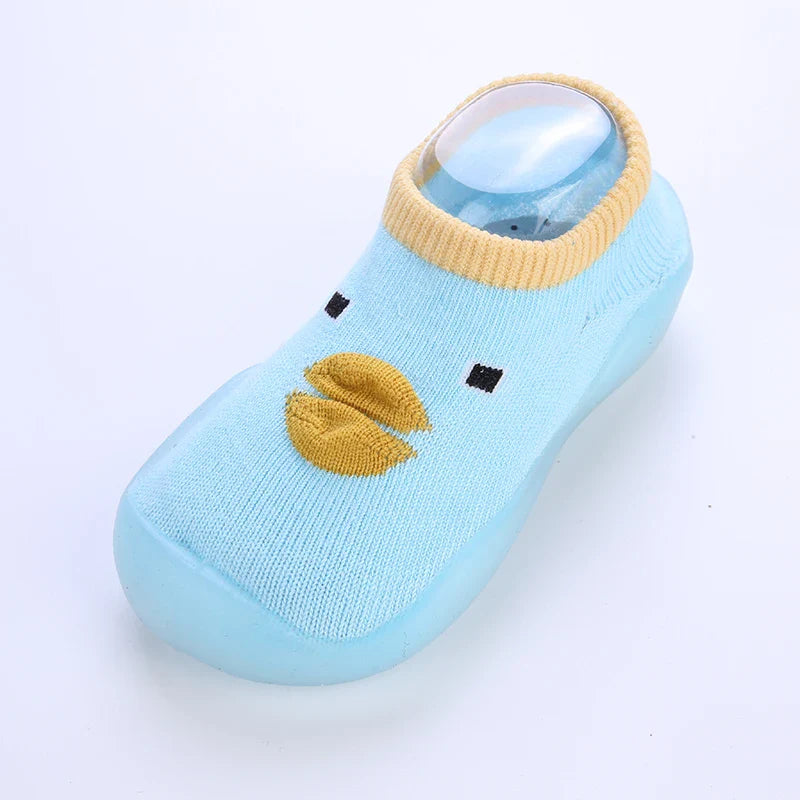 Gelbe, bequeme Antirutschsocken für Babys, perfekt als Krabbel- und Spielschuhe.