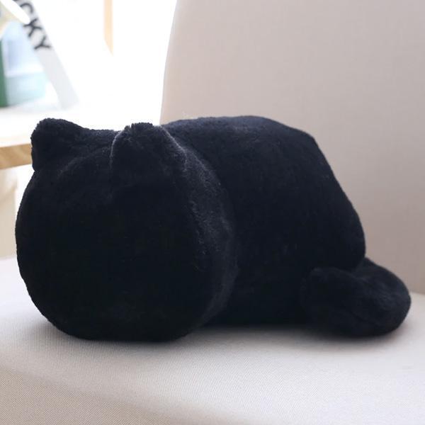 Gemütliches Katzenkissen aus Plüsch auf einem Bett, lädt zum Entspannen ein. Ideales Wohnaccessoire.