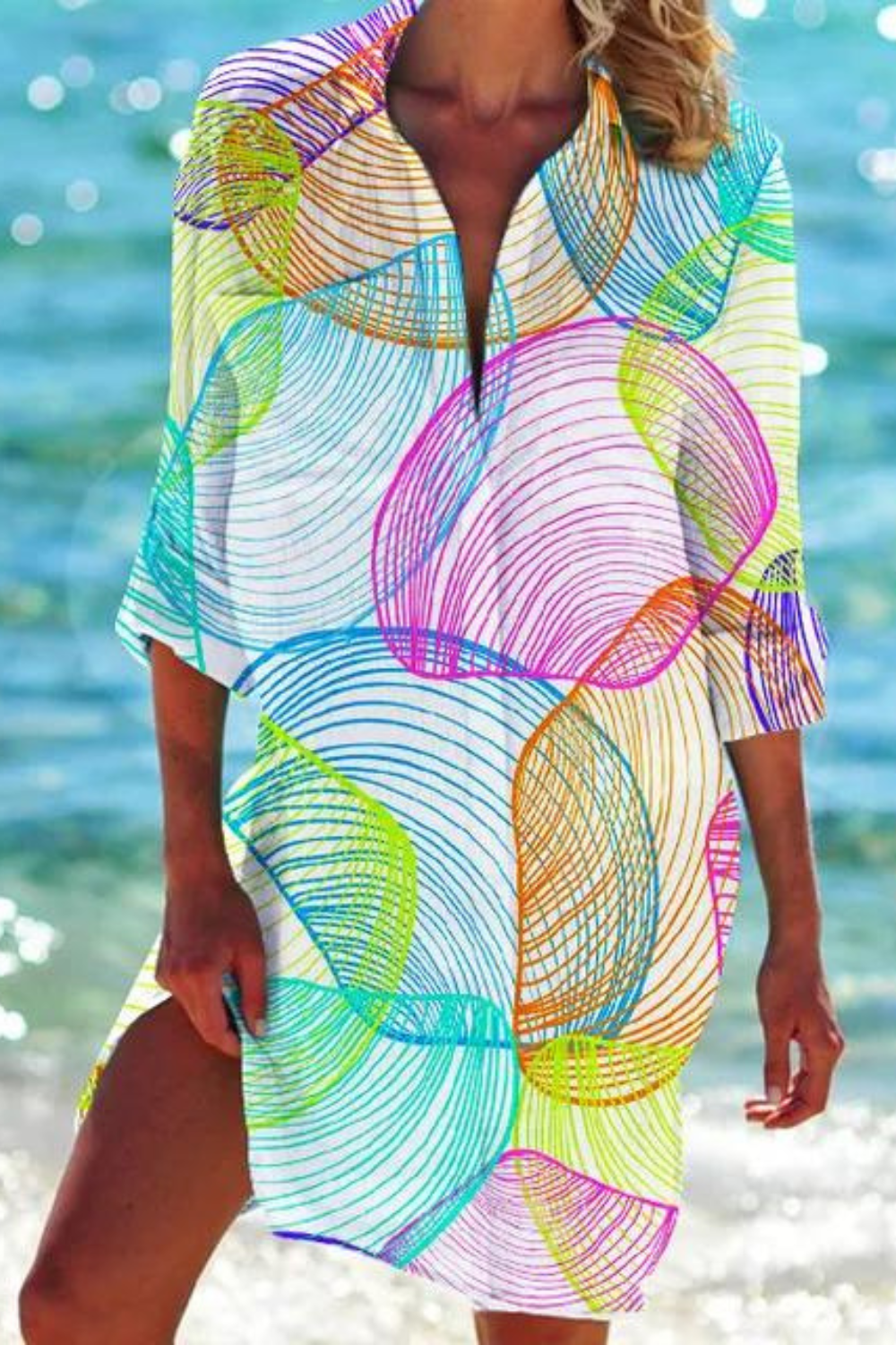 Damen Urlaubskleid: Lange Strandbluse mit zartem Meeresmotiv, locker geschnitten, ideal für heiße Sommertage.