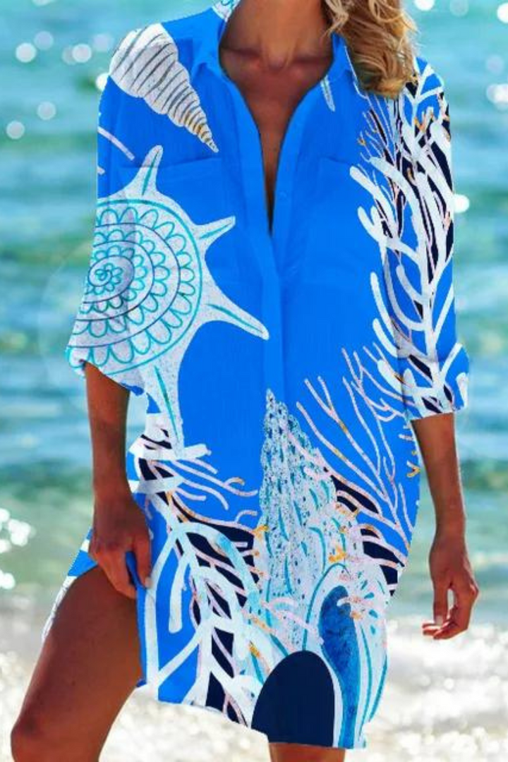 Trendige Damen Strandmode: Halbarm-Tunika mit elegantem Meeresmotiv, vielseitig als Freizeitkleid tragbar.