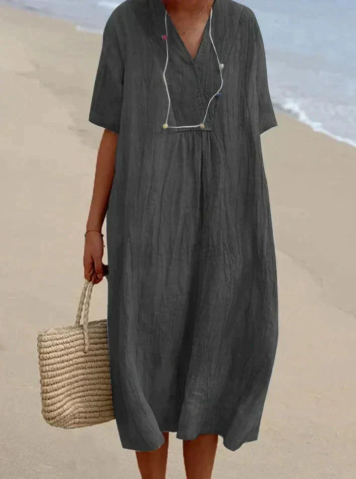 Elegantes Damen Sommerkleid in A-Linie mit V-Ausschnitt. Vielseitiges Strand- & Freizeitkleid für Damenmode.