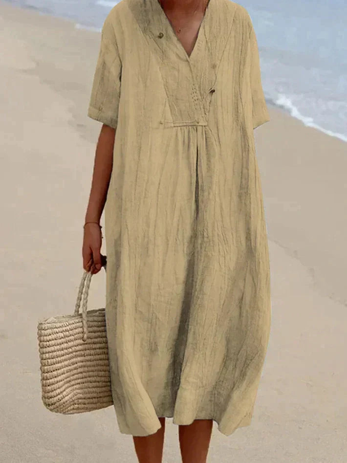 Frühlingshaftes Damen Sommerkleid mit V-Ausschnitt & A-Linie. Kurzarm, einfarbig, ideal für warme Urlaubstage.