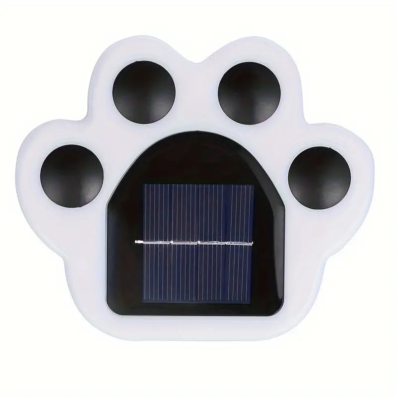 Zauberhafte LED-Außenleuchte in Pfotenabdruck-Form, solarbetrieben, spendet stimmungsvolles Licht im Garten.