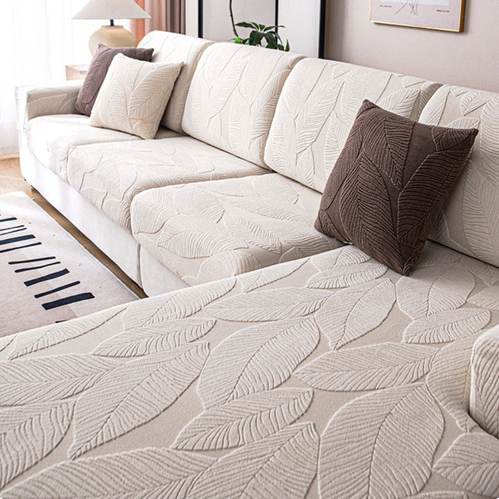 Moderner Jacquard Sofabezug mit Blättermuster. Wasserabweisend, kratzfest & elastisch.