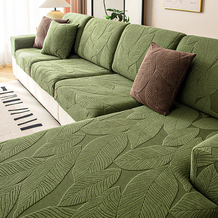 Perfekt sitzender, dehnbarer Jacquard Sofabezug mit Blättermuster. Wasserabweisend & kratzfest.