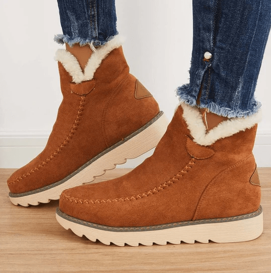 Warme Damen Winterstiefel mit rutschfester Profilsohle. Kuschelig gefüttert für Komfort und Wärme. Modische Damenschuhe.