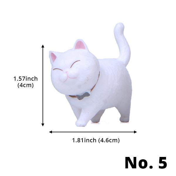 Nahaufnahme der handbemalten Oberfläche einer Mini Katzenfigur mit drehbarem Kopf.