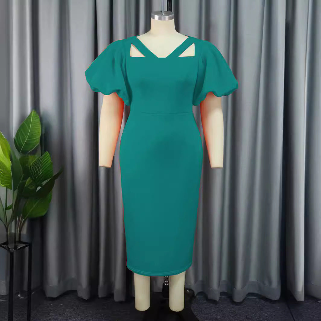 Stilvolles Partykleid in Orange für Damen, festlich und modern mit auffälligen Puffärmeln; figurbetont.