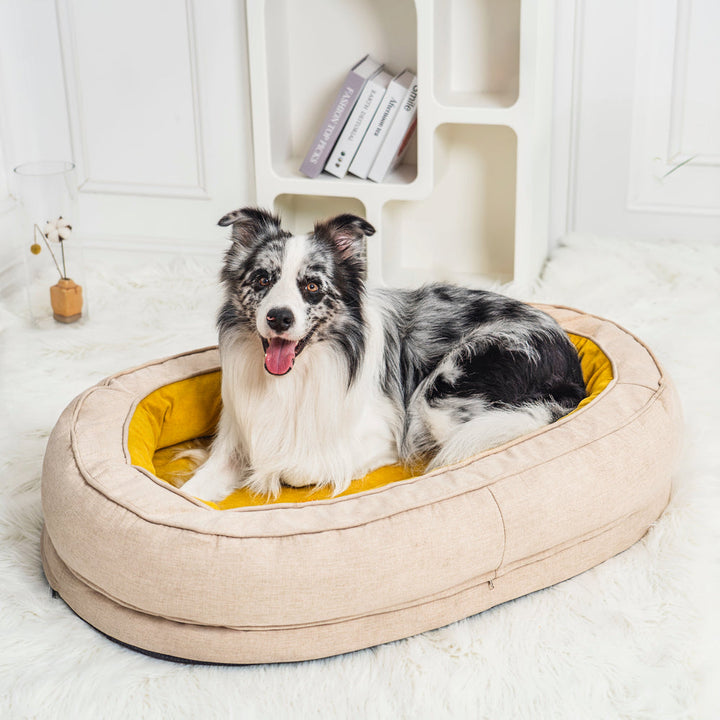 Weiches orthopädisches Donut-Hundebett in Hellgrau, perfekt für Gelenkschutz.