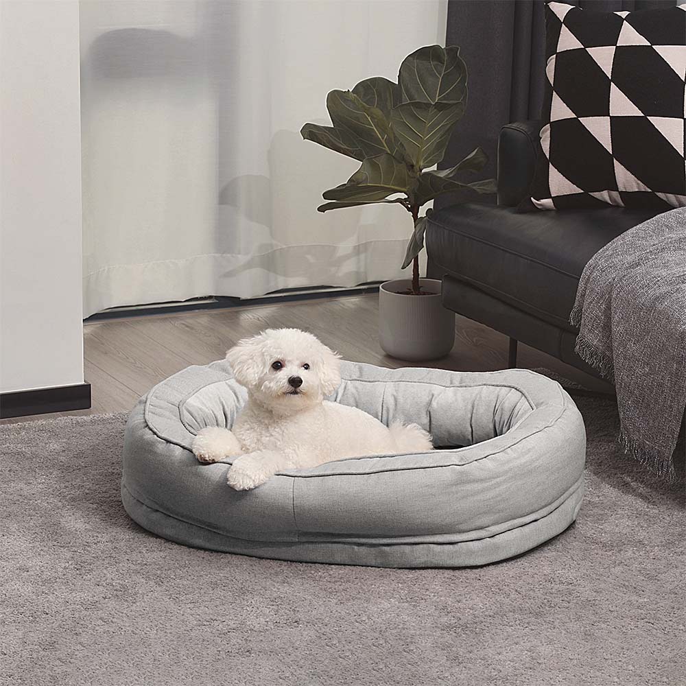 Einzigartiges Donut-Hundebett, orthopädisch & gemütlich, ideal für entspannte Hunde.
