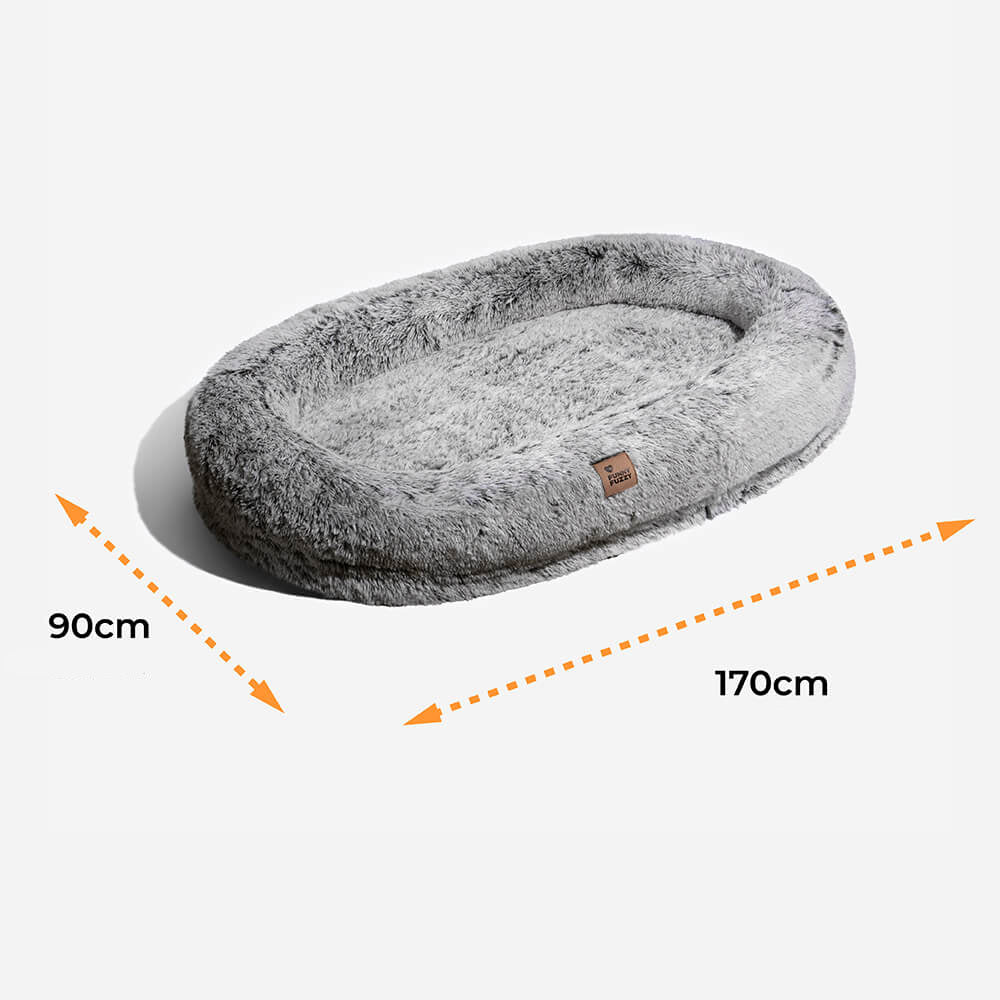 Orthopädisches Donut-Hundebett für Tiefschlaf, mit hoher Seitenwand für Geborgenheit.