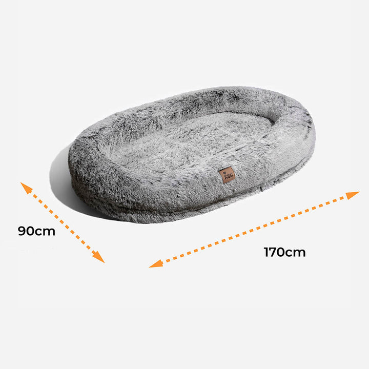 Orthopädisches Donut-Hundebett für Tiefschlaf, mit hoher Seitenwand für Geborgenheit.