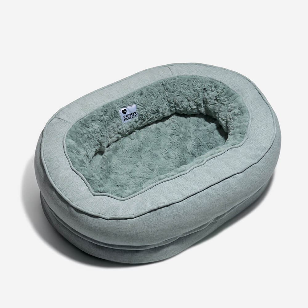 Gemütliches Donut Hundebett, orthopädisch, waschbar & rutschfest für entspannte Hunde.
