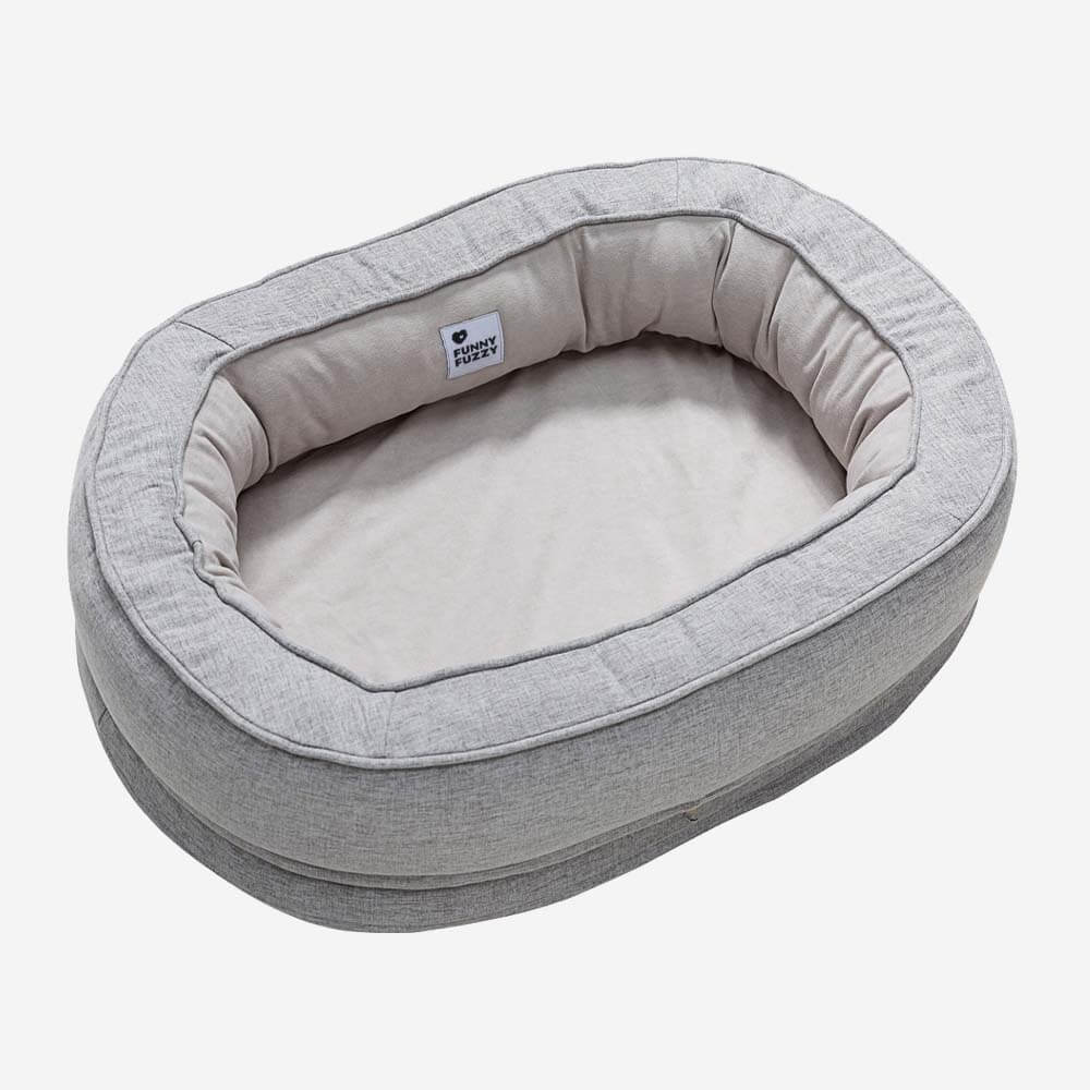 Das beliebte orthopädische Donut Hundebett, jetzt mit verbessertem Anti-Rutsch-Boden.