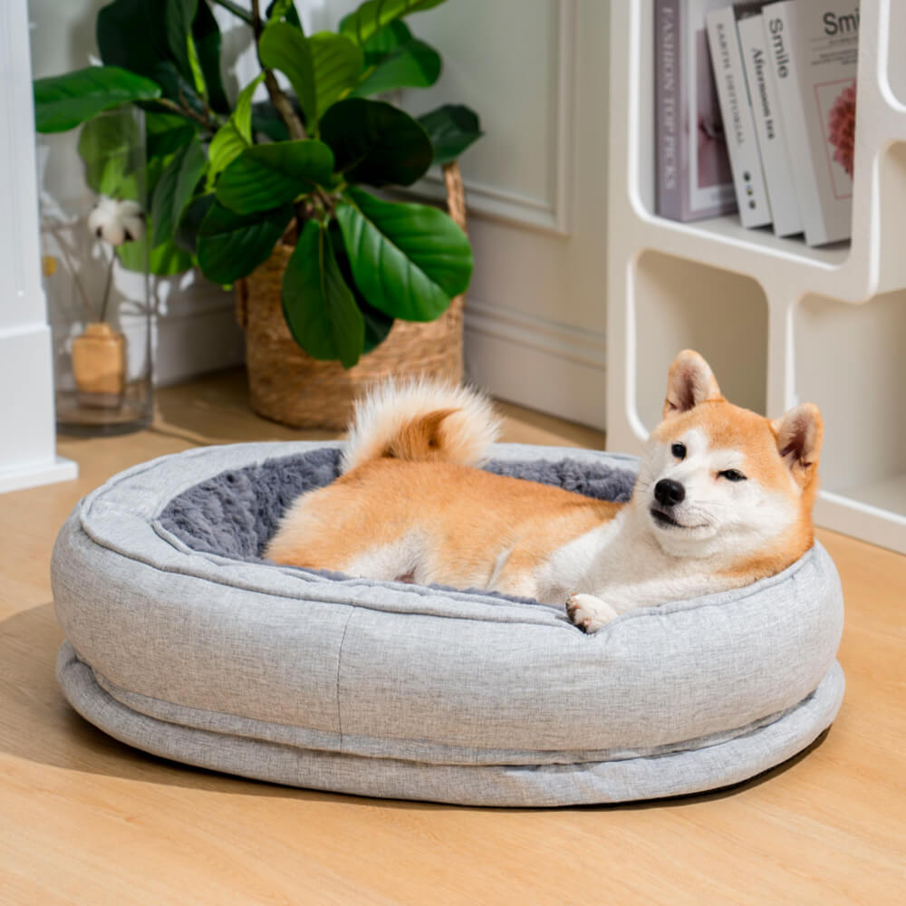 Strapazierfähiges orthopädisches Donut Hundebett, wasserabweisend & leicht zu reinigen.