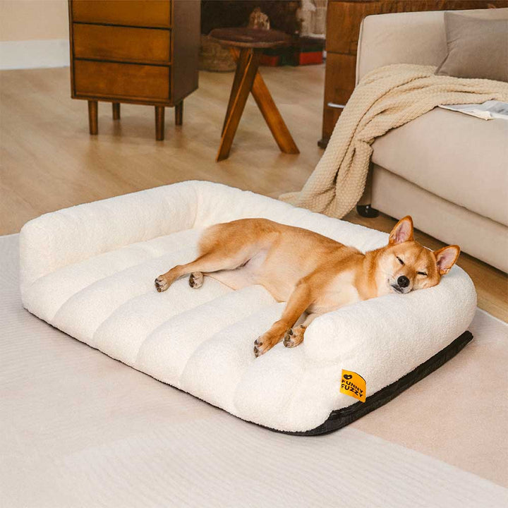 Orthopädisches Eckhundebett mit Stützfunktion & Kopfstütze aus Teddyfleece für Komfort & Gelenkschutz.