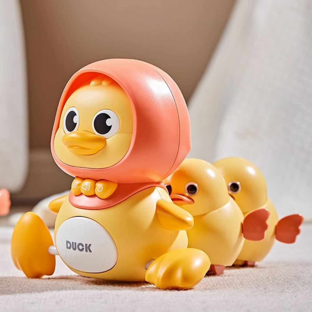 Farbenfrohes rosa & gelbes Entenspielzeug, watschelt fröhlich; interaktives Lernspiel für Kinder.
