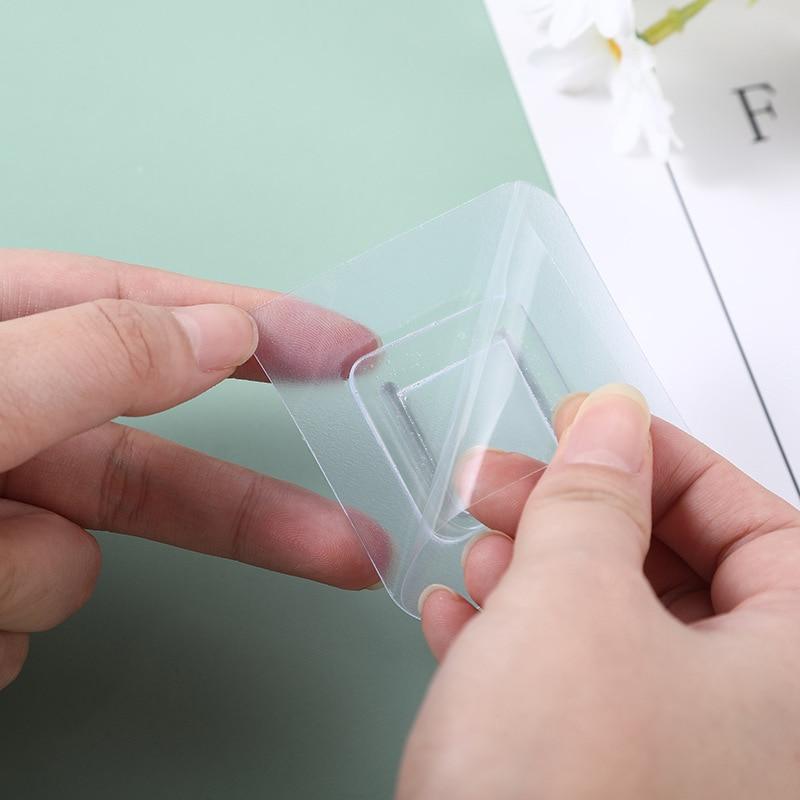 Starke selbstklebende Wandhaken, robust und transparent, für einfache, bohrfreie Organisation.