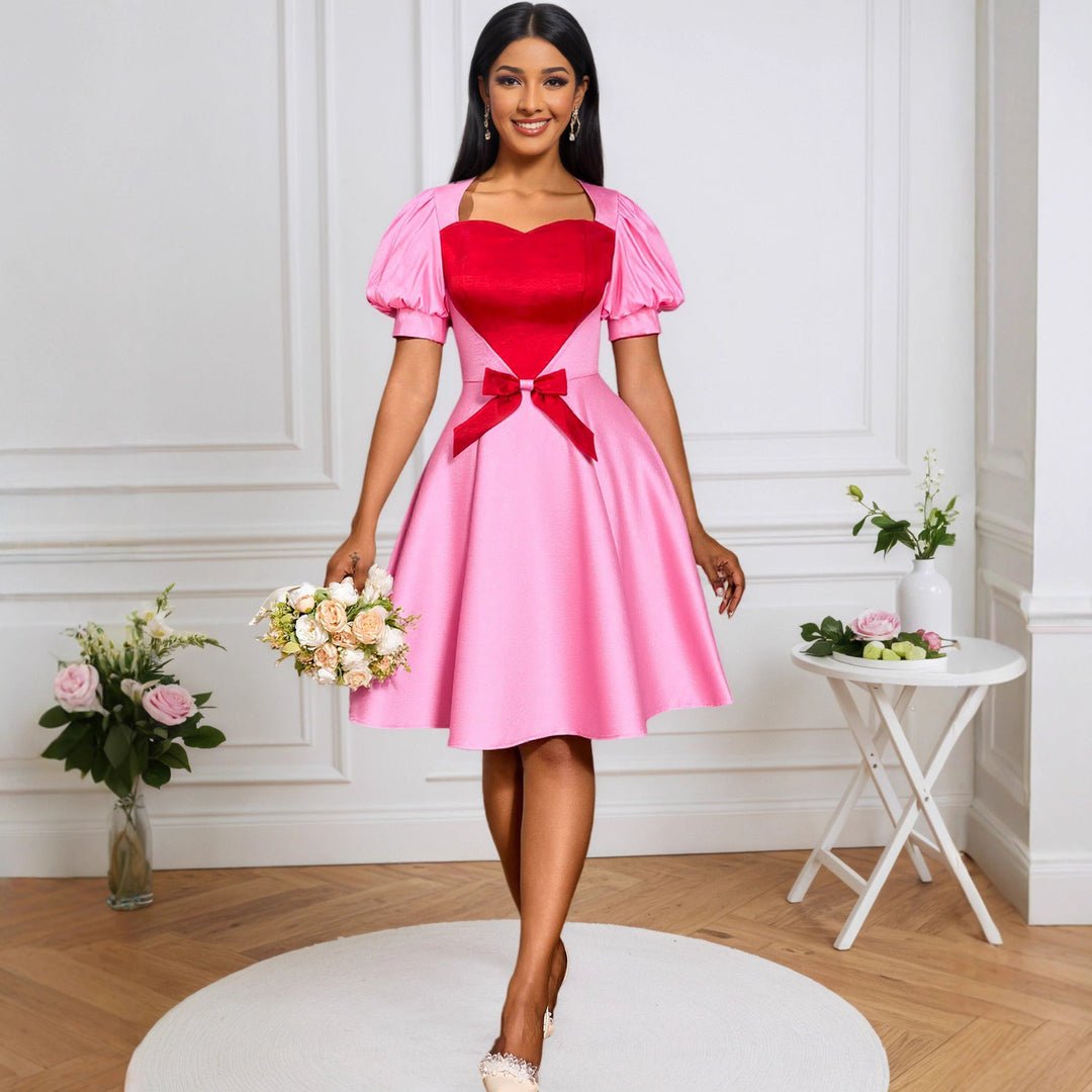 Rosafarbenes elegantes Damenkleid mit Herz-Ausschnitt und Puffärmeln, ideal für festliche Anlässe und Partys.