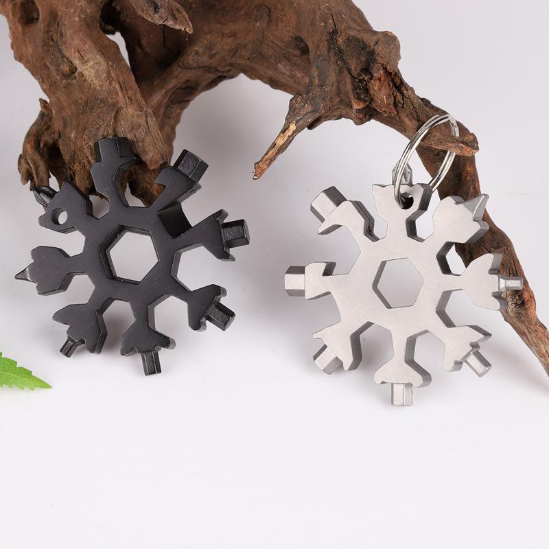 Schneeflocken Multitool aus Edelstahl mit 18 Funktionen, ideal für Outdoor, Camping & Fahrradreparatur.