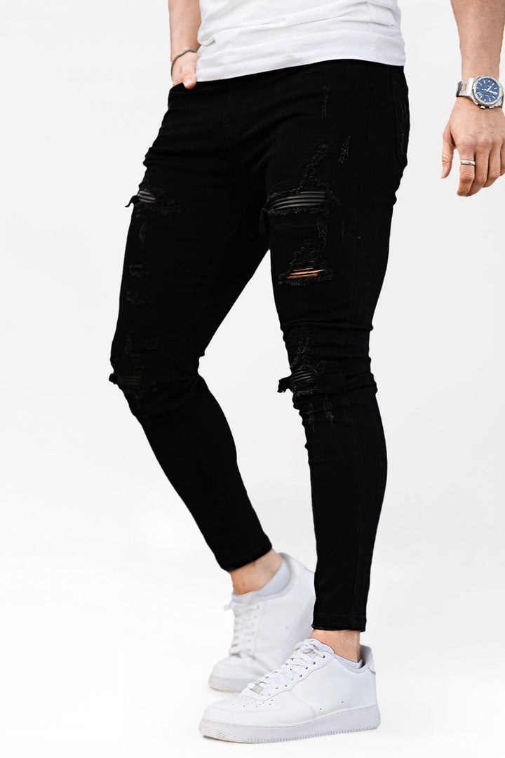 Schwarze Herren Skinny Jeans zerrissen, slim fit, bequem für Streetwear & Alltag.