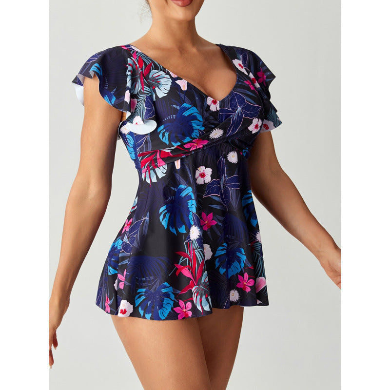Rosa Damen Badeanzug, figurbetont mit Raffung, floralem Design und V-Ausschnitt, perfekt für stilvolle Sommer-Looks.