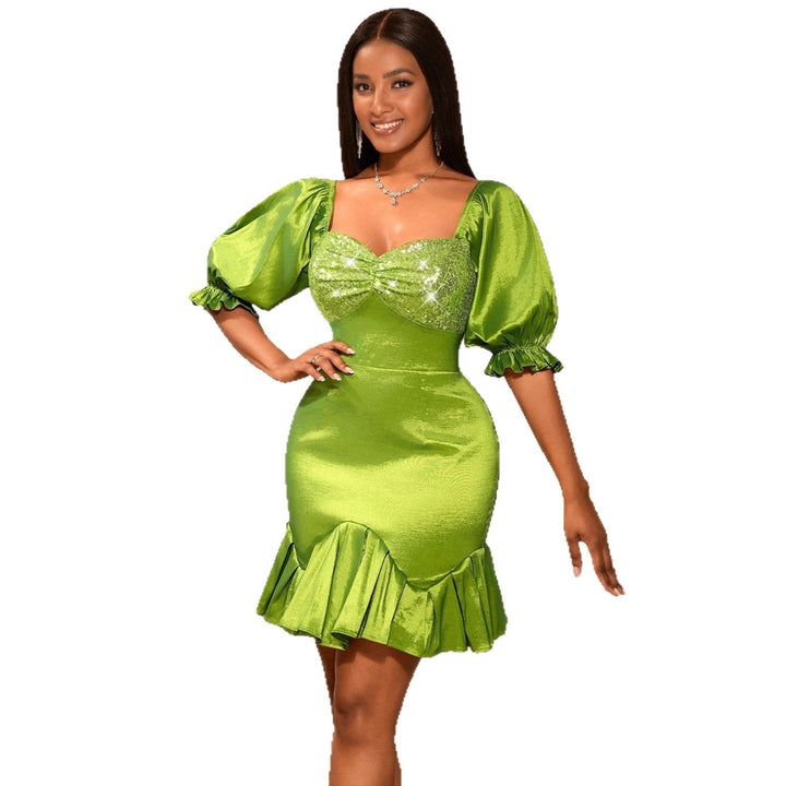 Festliches Damenkleid Senfgelb mit funkelndem Glitzer-Bustier und eleganten voluminösen Ärmeln für Abend-Events.