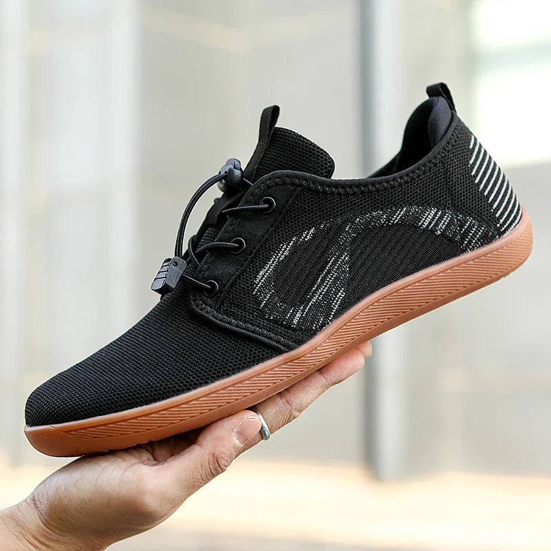 Bequeme Herren-Sportschuhe in Grau, Schwarz und Rot. Komfort-Sneaker für Herren, ideal für Sport & Freizeit.