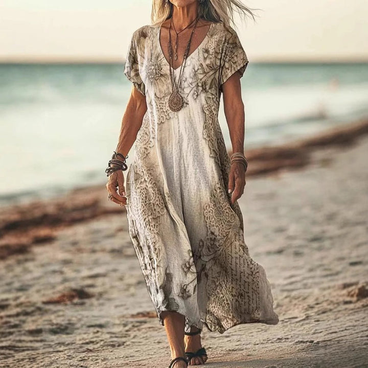Elegantes Damen Sommer Maxikleid mit tiefem V-Ausschnitt und frischem Print. Perfekt für den Sommer.
