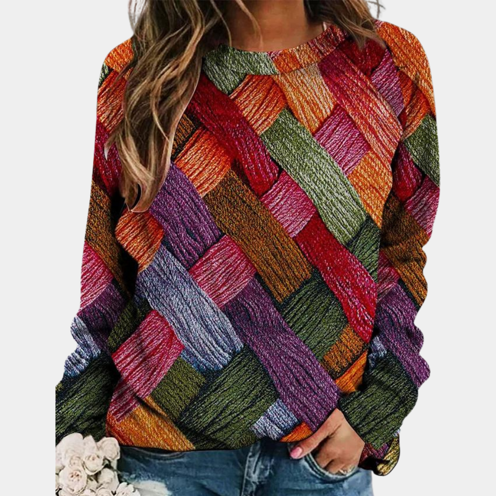Damenpullover Camilla mit lebendigem, buntem Patchwork-Design. Bequemer Strickpullover für stilvolle Herbstmode.