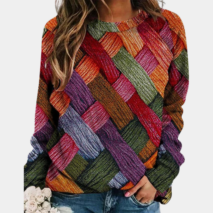 Damenpullover Camilla mit lebendigem, buntem Patchwork-Design. Bequemer Strickpullover für stilvolle Herbstmode.