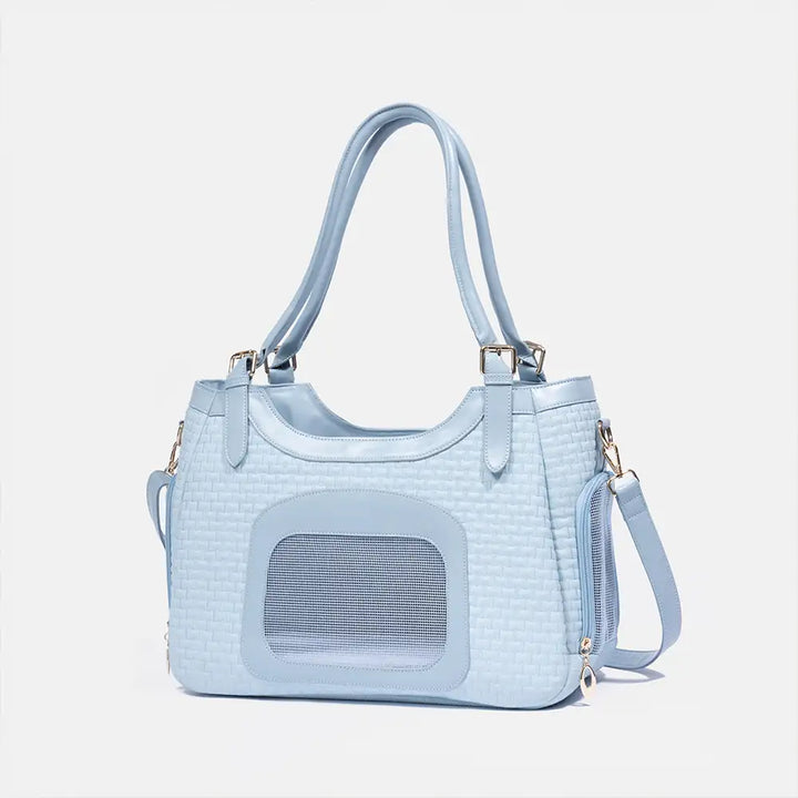 Praktische Reisetasche für Haustiere aus Kunstleder; atmungsaktiv & leicht zu tragen.