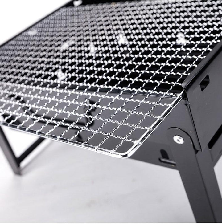 Hochwertiger Stahl-Holzkohlegrill, robust & langlebig für alle Outdoor-Abenteuer. Perfekter Reisegrill.
