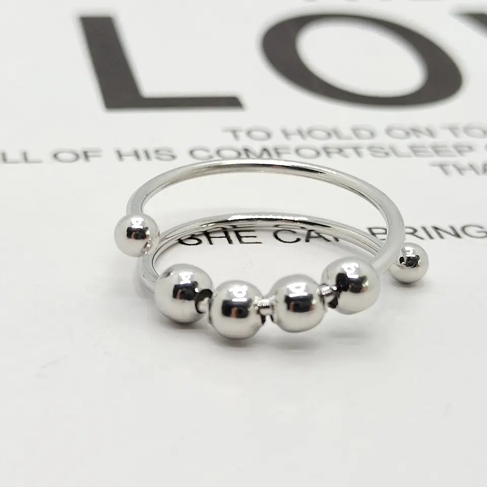 Unisex Anti-Stress Spinner-Ring in Silber, zur Beruhigung und Angstlösung durch sanftes Drehen, verstellbarer Fidget Ring.