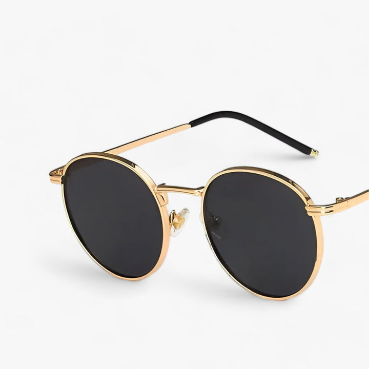 Trendy Nova Sonnenbrille mit runden Gläsern, schlankem Metallrahmen & 100% UV-Schutz.