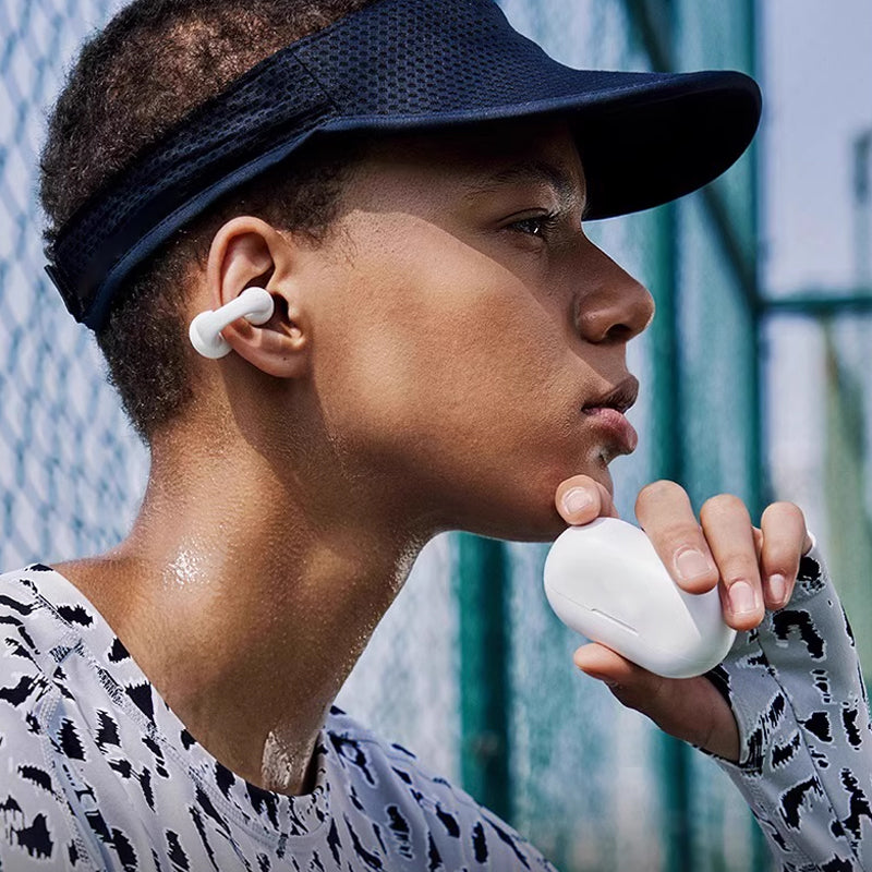 Ergonomische wasserdichte Bluetooth Ohrhörer, unisex, kabellos, für sicheren Halt beim Training.