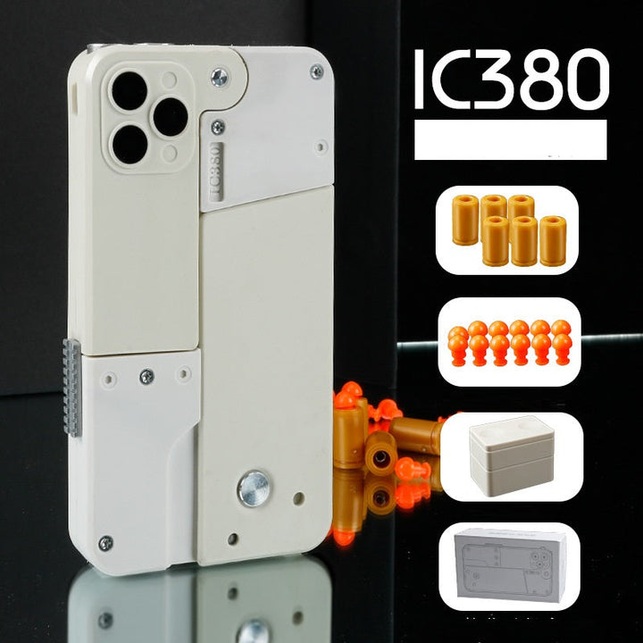 Kompakte Spielzeugpistole im iPhone-Look mit Soft-Kugeln; ein Spass-Gadget für Geschenke und Überraschungen.