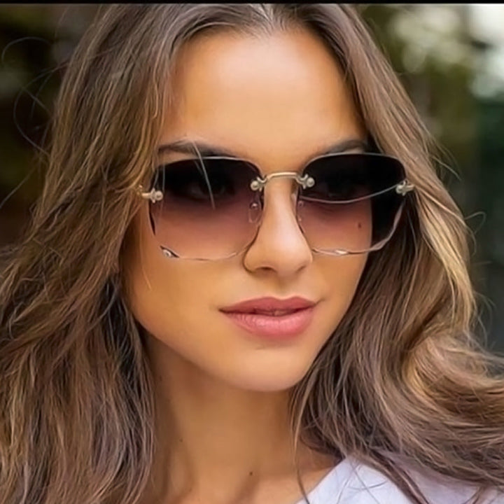 Unisex randlose Sonnenbrille im Vintage-Stil mit UV400-Schutz, ideal für Sommer-Accessoires.