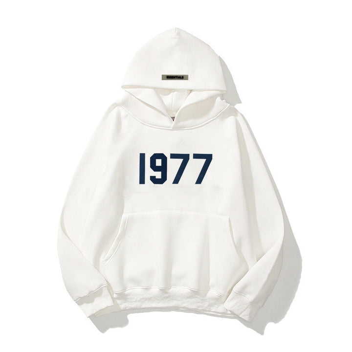 Stylischer Unisex Raglan Hoodie, Vintage 1977 Design, bequemer Kapuzenpullover für modernen Streetwear.