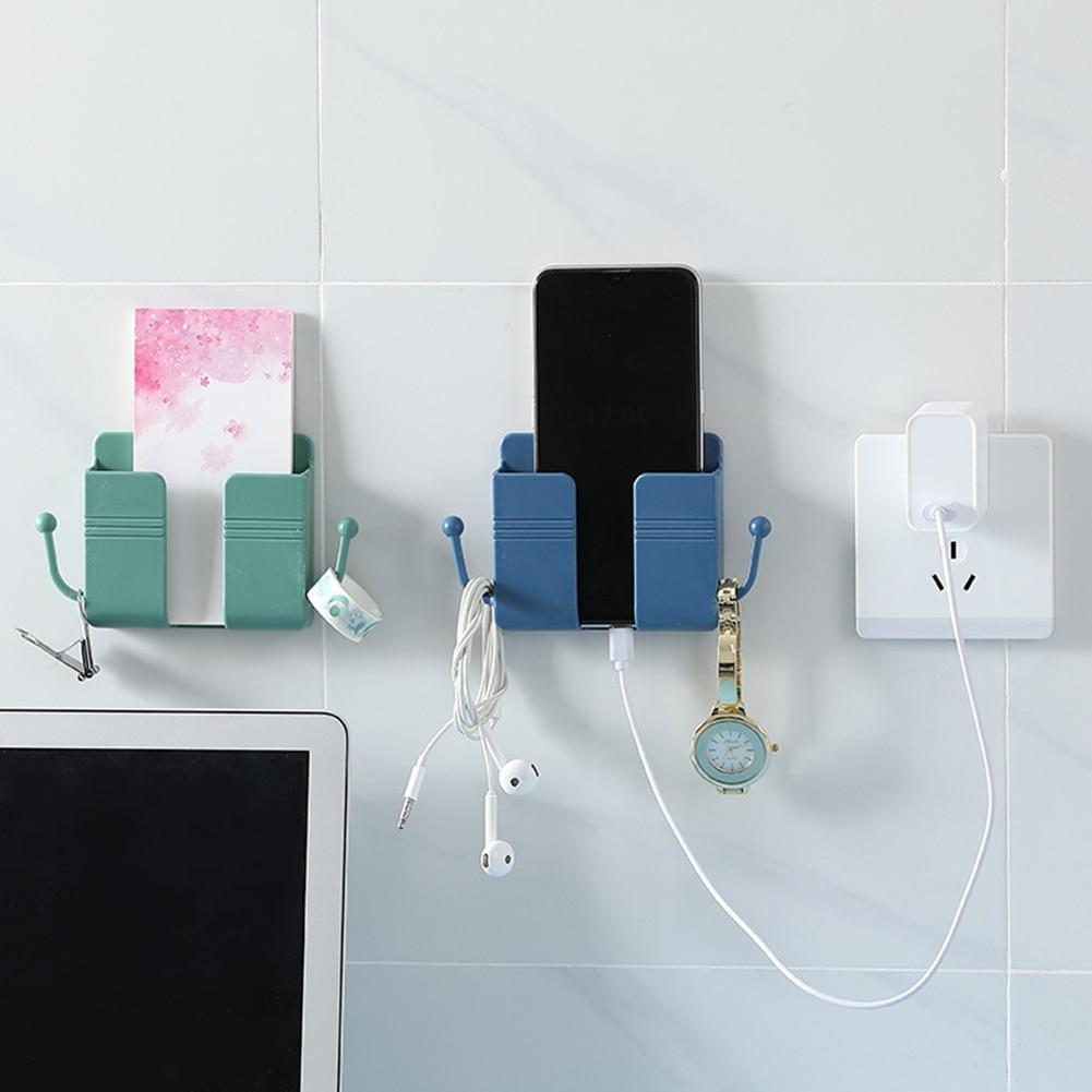 Elegante weiße Wandhalterung für Handys & Fernbedienungen; minimalistisches Design für jede Wand.